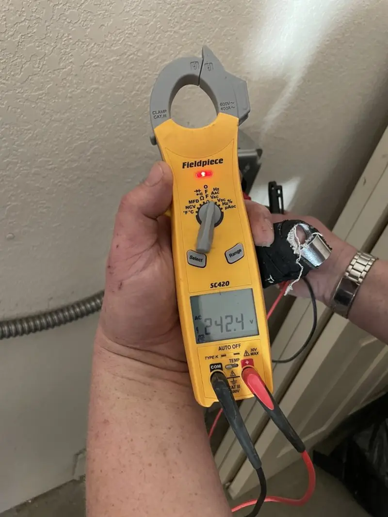 Voltage testing with clamp meter during Electrical Installation Services in Brownsville